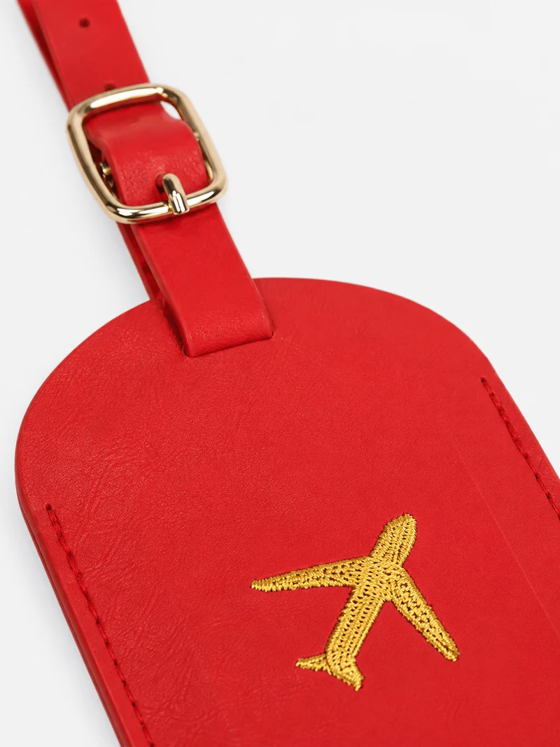 Étiquette de bagage en cuir motif avion avec porte-adresse