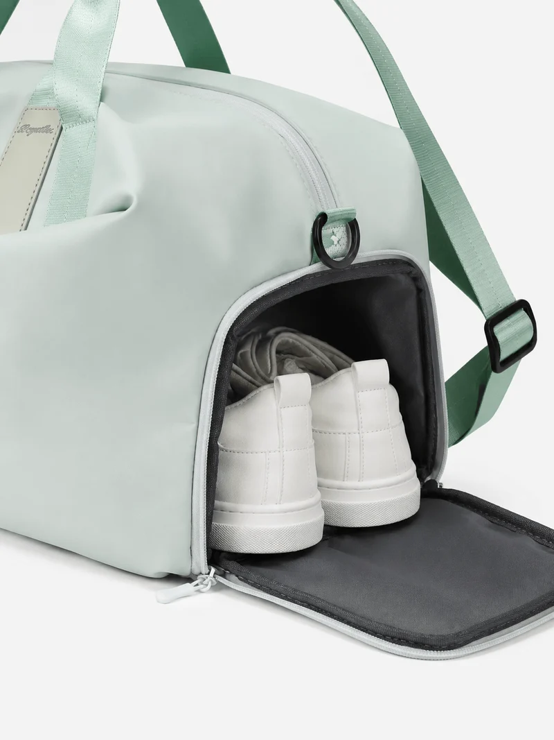 Sac de sport femme vert menthe en nylon, compartiment sec et humide
