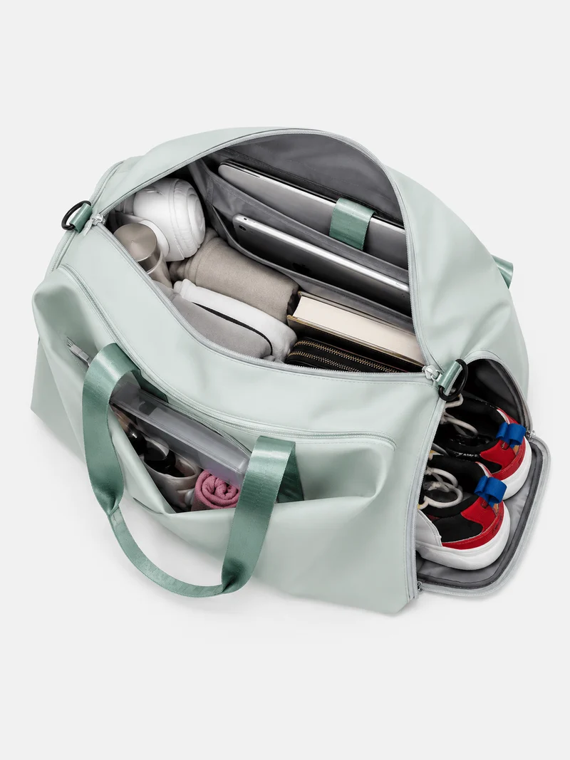 Sac de sport femme vert menthe en nylon, compartiment sec et humide